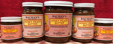 A picture of several jars of Bauman's honey peach butter