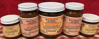 A picture of several jars of Bauman's peach butter