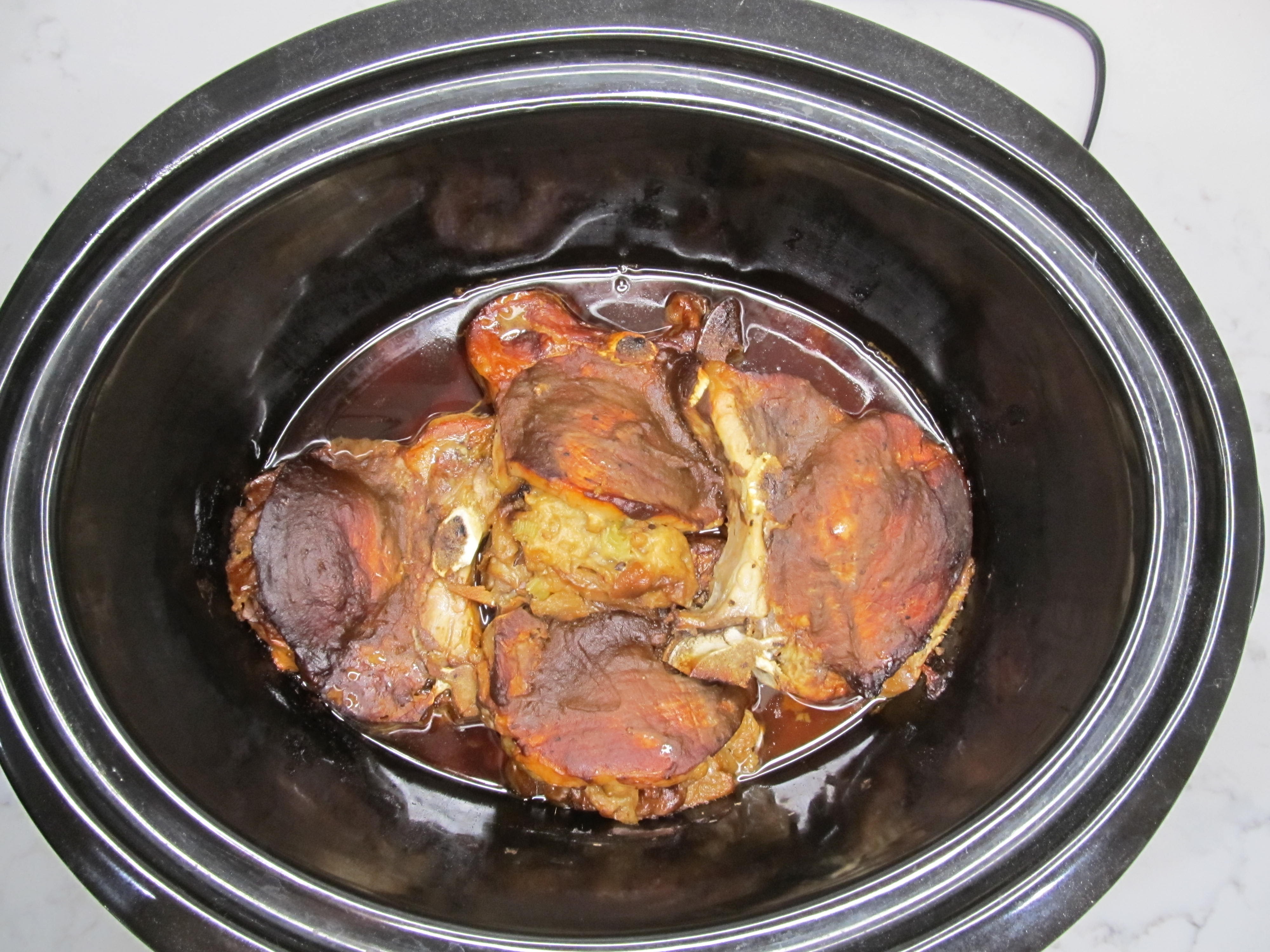 Stuffed pork chops coated with apple butter