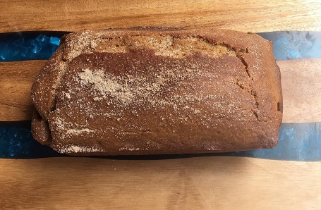 A picture of a loaf of apple cider cake