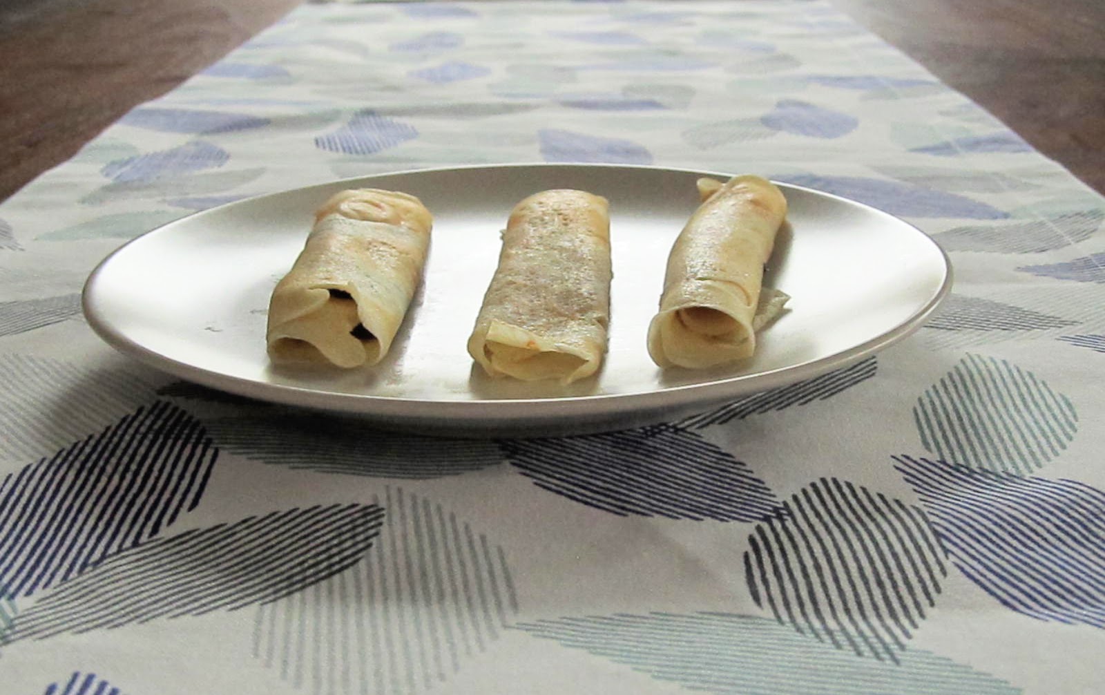 Rolled crepes filled with fruit butter